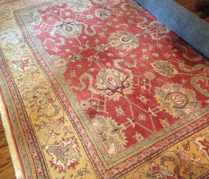 Red area rug on floor.